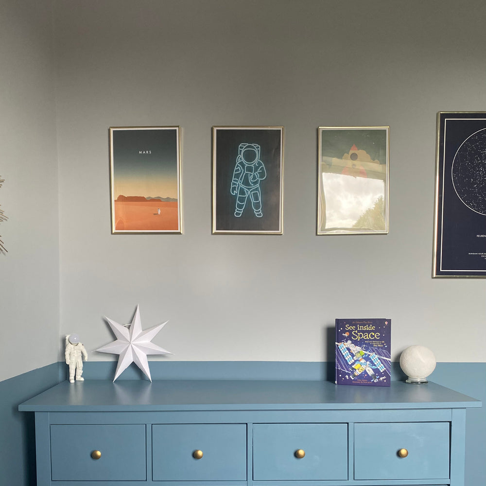 Child's room with grey-blue chest of drawers in Lie-in by COAT Paints, with space posters