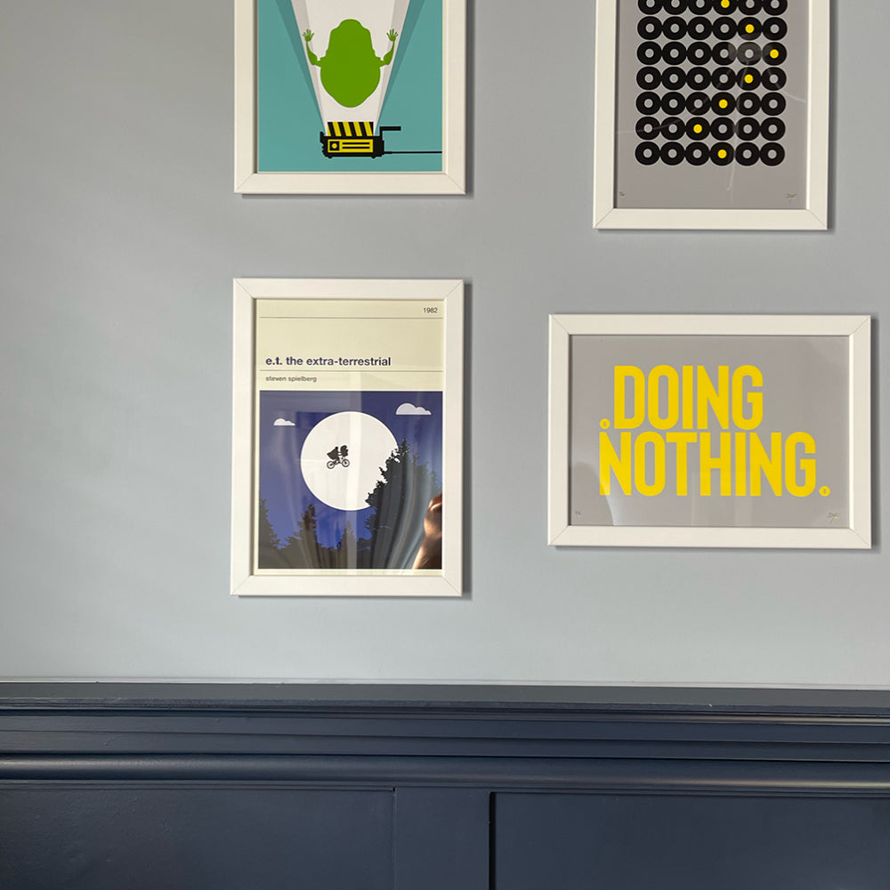 Living room with grey-blue walls in Lie-in by COAT Paints, with gallery wall of framed prints